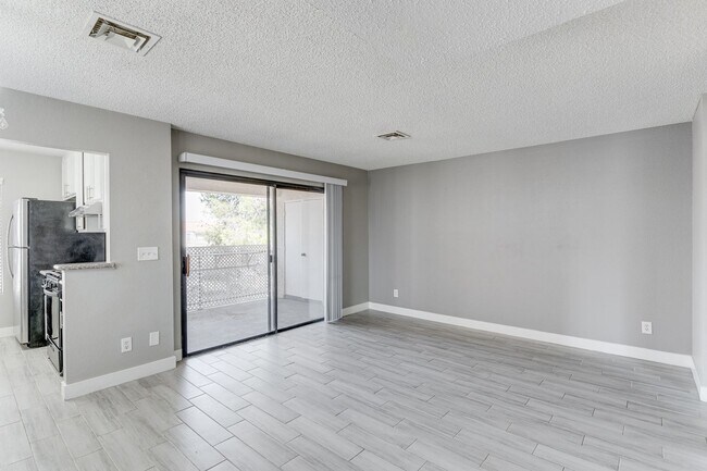 Building Photo - Stylish Upstairs Condo with Dual Primary S...