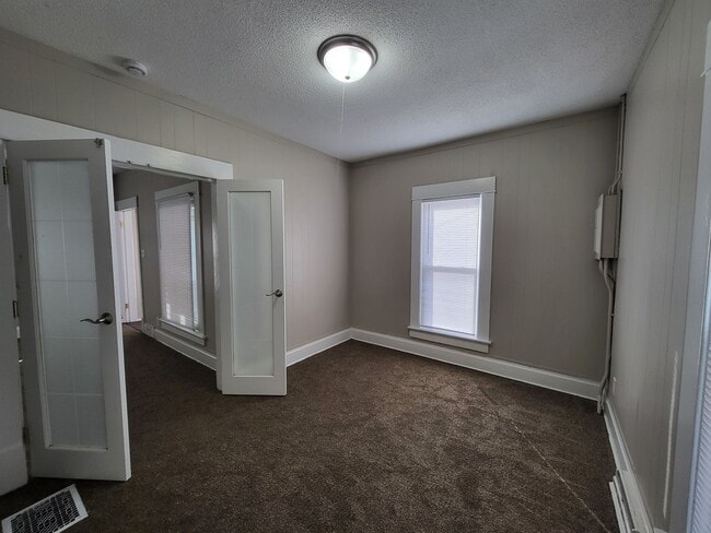 Building Photo - Two bedroom home with partially fenced yard!