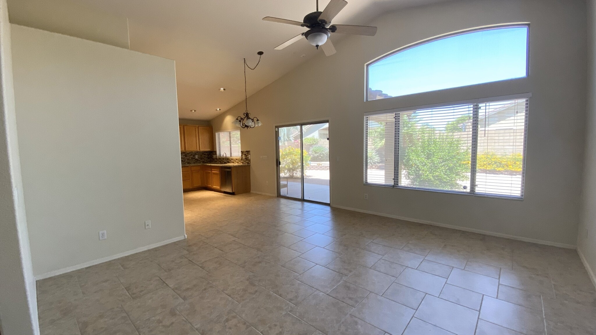 Living room/dining area with preview into kitchen - 6806 W Quail Ave