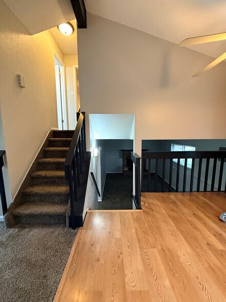Stairs to upper level - 5879 S Oak St