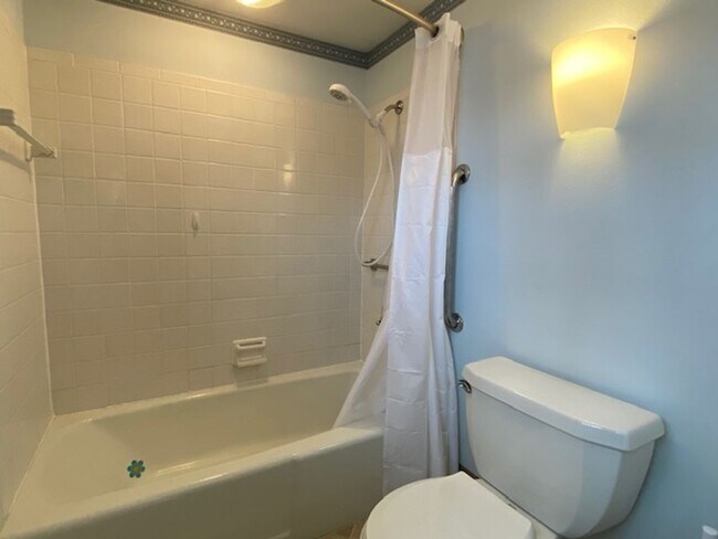 Building Photo - Welcome to this charming three-bedroom, tw...