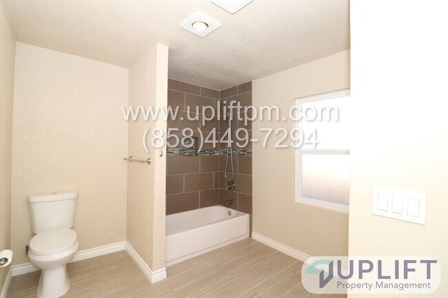 Building Photo - 4 Bedroom 2 Bathroom with Garage and Green...