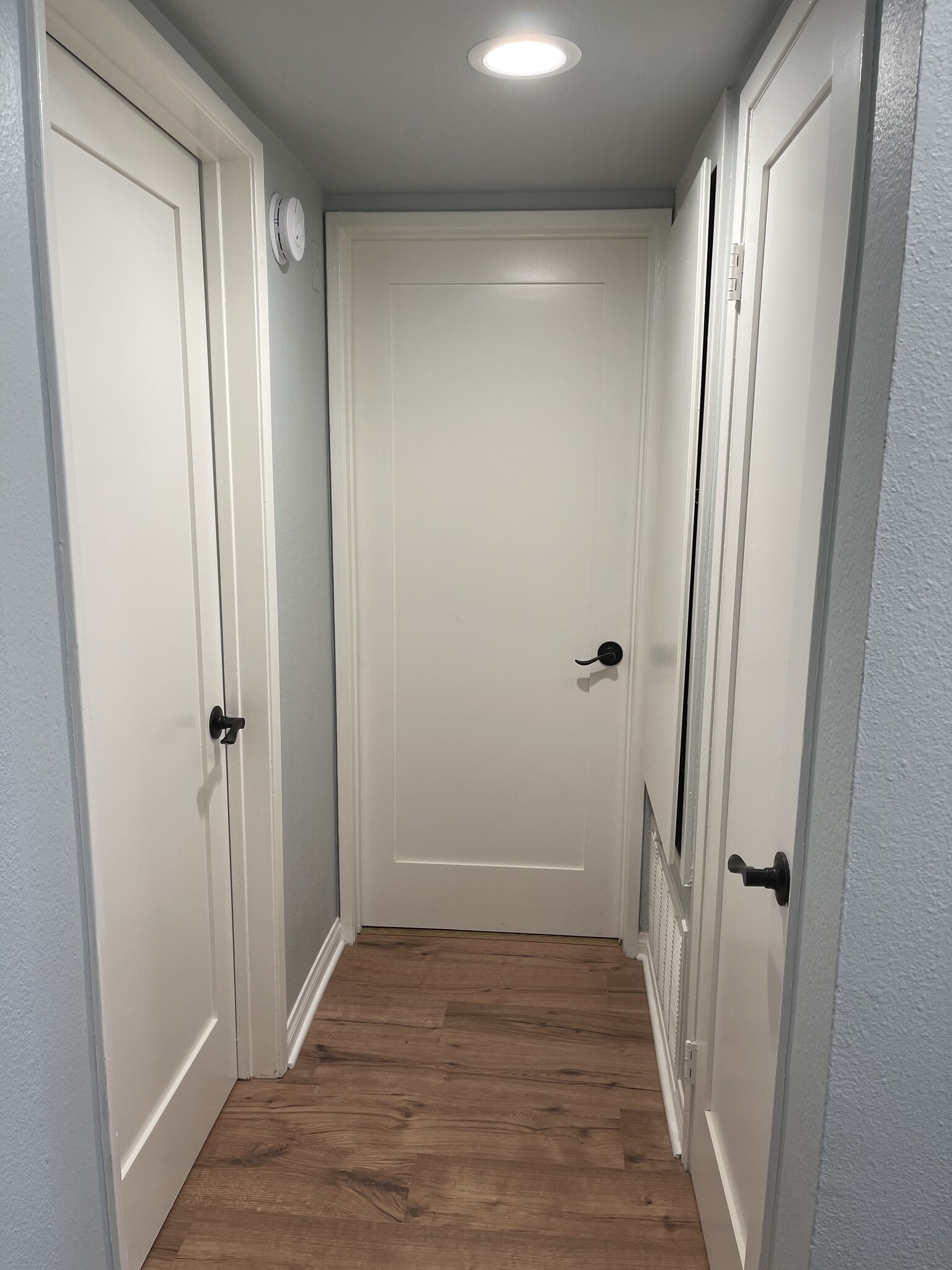 Doors to secondary bedroom, front bathroom and coat closet - 5525 Canoga Ave