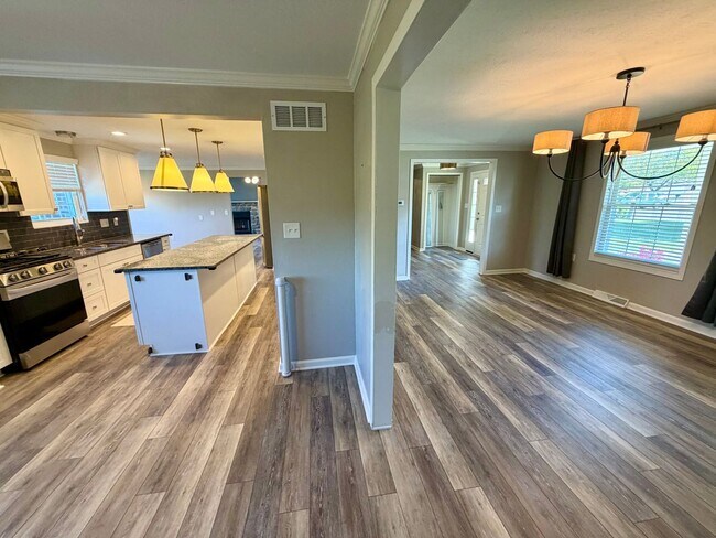 Building Photo - Modern Comforts Await: Spacious Rental with 2-Car Garage, Private Office, and Finished Basement w...