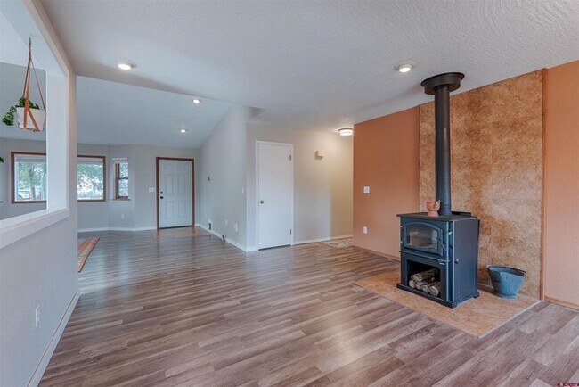 Excellent working wood burning stove. It's super cozy in the winter! - 64251 N Ramona Rd