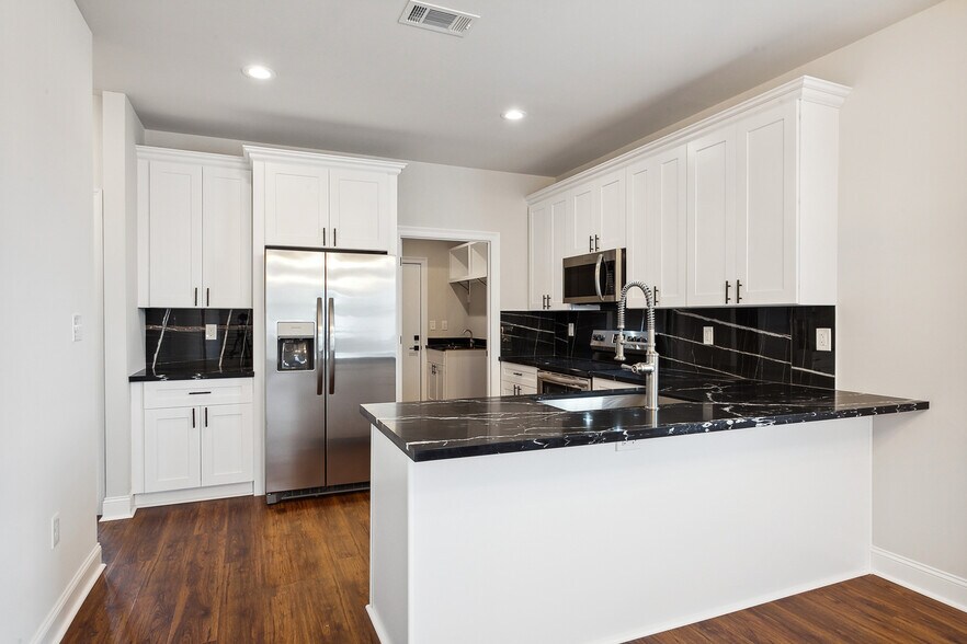 Kitchen and Laundry room in back Appliances included - 1324 Harrison Ave