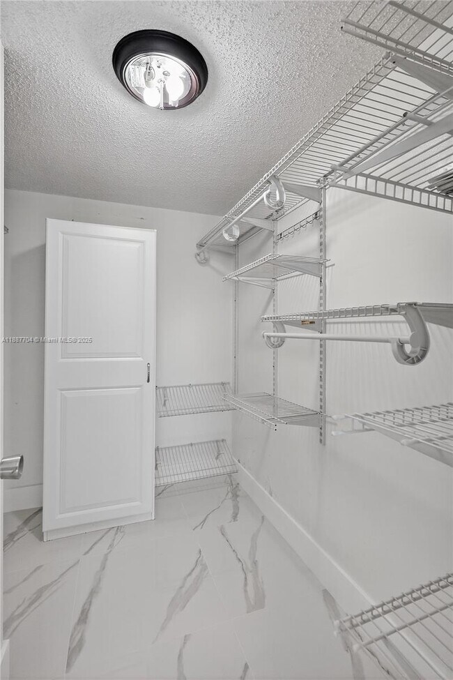 Building Photo - 9915 W Okeechobee Rd