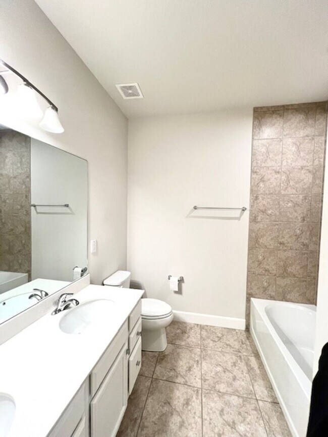 Building Photo - Open concept home offering four bedrooms, three baths, a two car garage and open lanai.