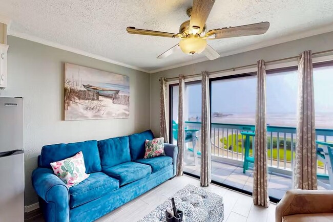 Ocean front living room view w/patio - 6102 Seawall Blvd