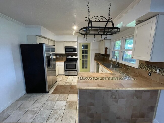 Building Photo - Spacious Home with Large Yard, Hot Tub, and More