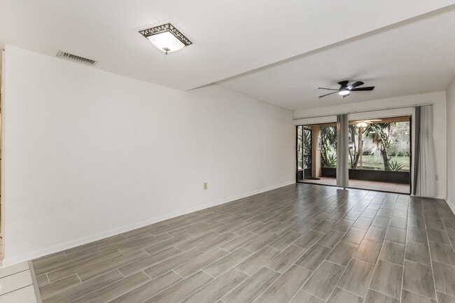 Building Photo - 3 BR / 2 BA Ground-Floor Condo | Screened ...