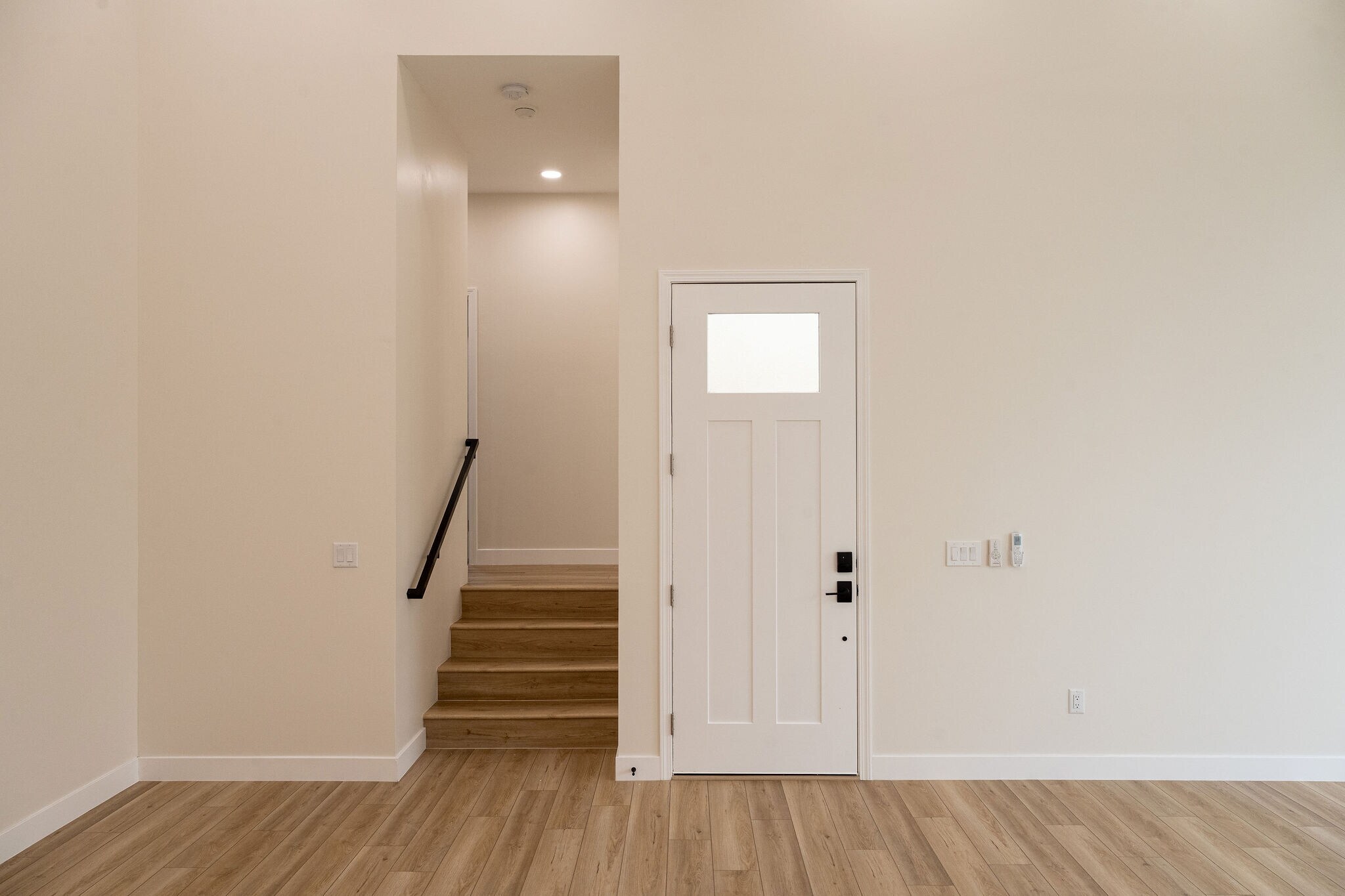 view of front door from living room, and view of hallway to bedrooms - 4774 Bancroft St