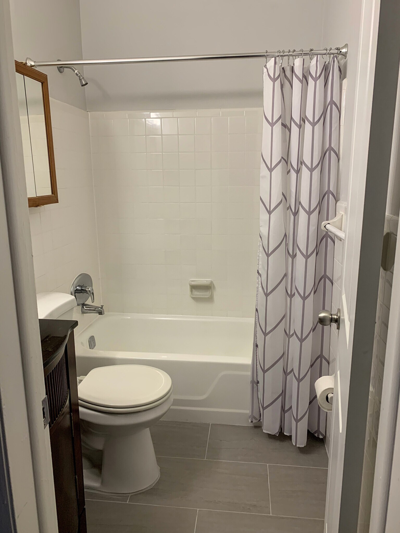 Renovated Primary Bathroom with Spanish Tile and Tub/Shower Combo - 1400 NE 57th St
