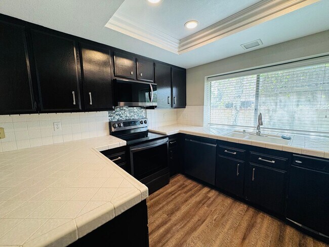 Building Photo - Don’t Judge the Outside—This 3BR Stuns Inside
