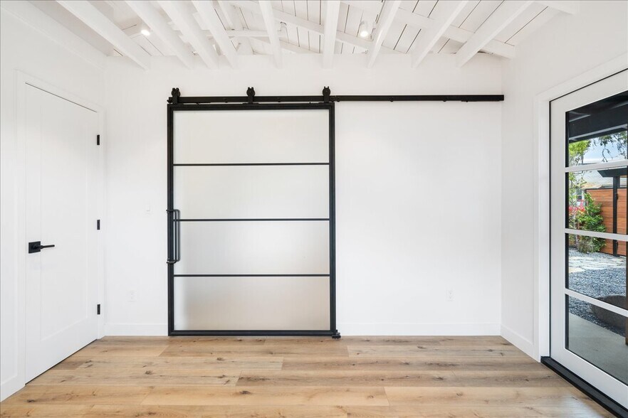 Bedroom with barn door closed - 4027 Moore St