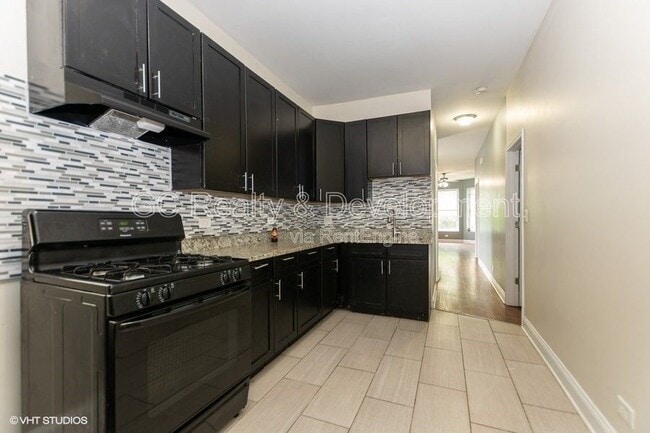 Building Photo - 7642 S Normal Ave