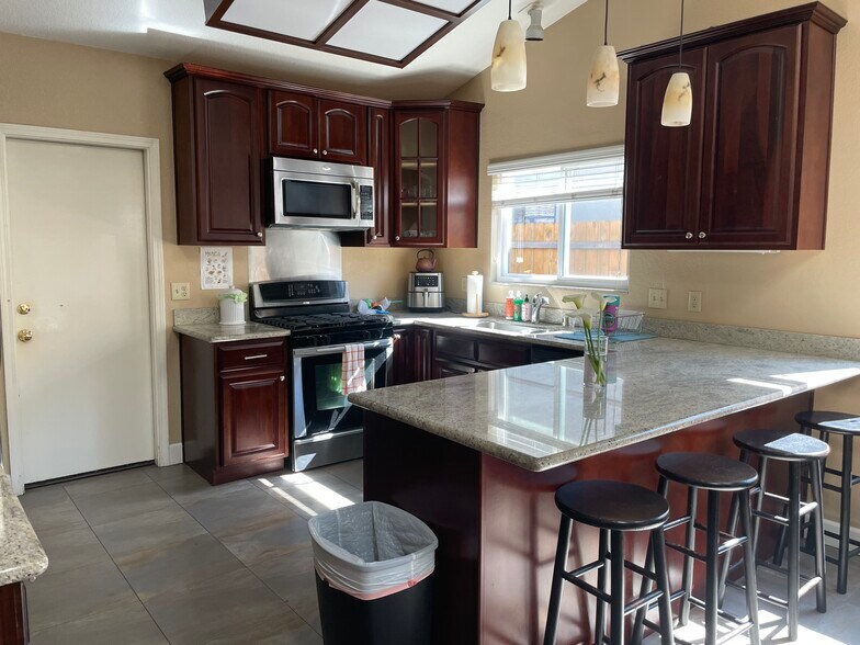 Kitchen with door to garage - 205 East Sierra Avenue