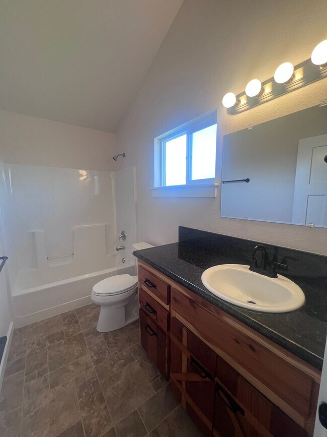 Building Photo - 2 Bedroom 1 bath house with extra large double car garage and extra storage space!