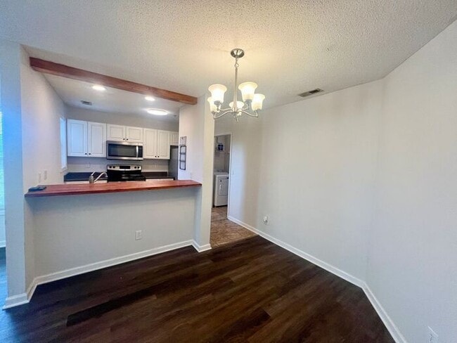 Building Photo - Freshly Painted! New Luxury Vinyl Plank Fl...