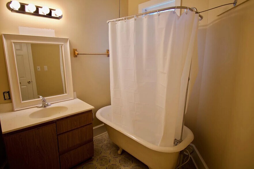 Bathroom featuring clawfoot tub & shower - 918 Gratz Street, Unit #2