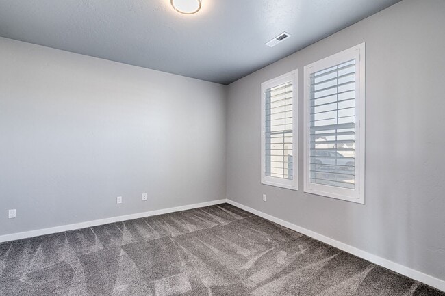 Building Photo - Custom Hunter-Douglas shutters throughout.