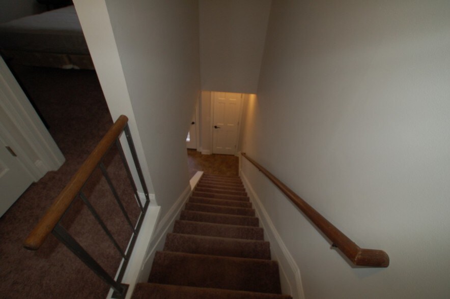 Stairs to upper level - 14711 N River Beach Dr