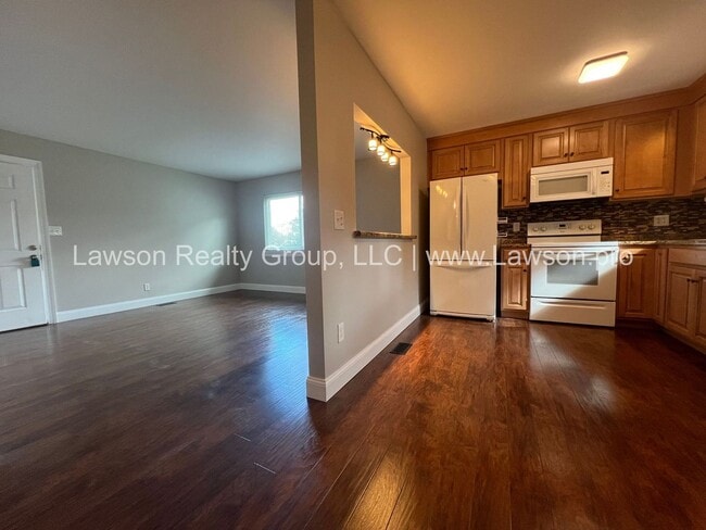 Building Photo - One Level Living- Beautifully Landscaped Yard and Attached Carport