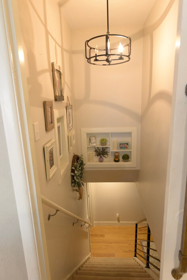 Hallway to downstairs area - 932 S Holly St