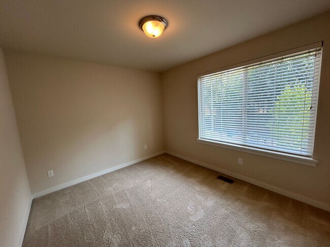 Building Photo - 4 bed/2.5 bath and 3 car garage and a down...