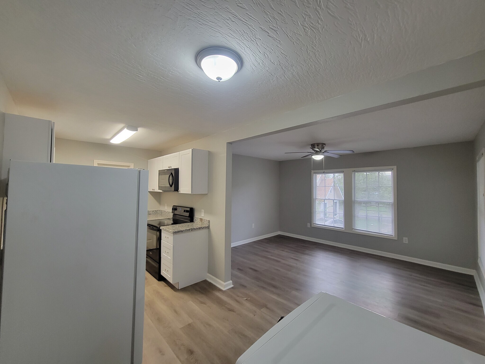 Heading through the living room to the bedroom - 320 S Ashbel St