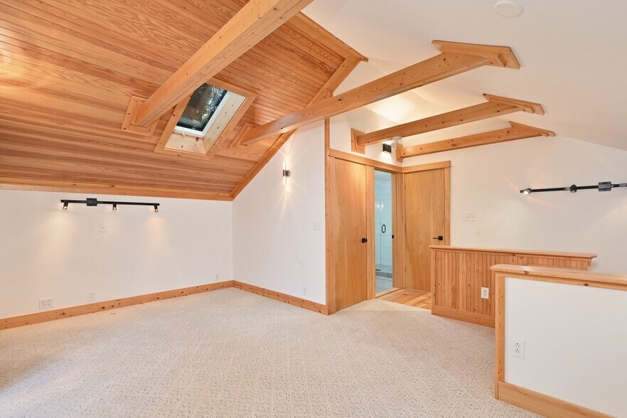 Bedroom, W/D closet (left), door to bathroom, closet (right). - 8752 Dayton Ave N