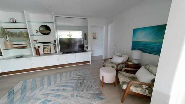Relaxing sitting area with recessed lighting and original art work from a local artist - 426 Ilimano St