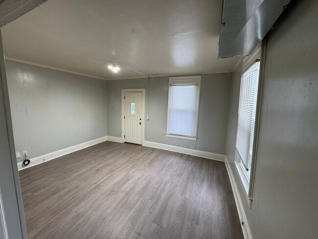Building Photo - Interested in a two-bedroom house that includes a large garage. Please let us know