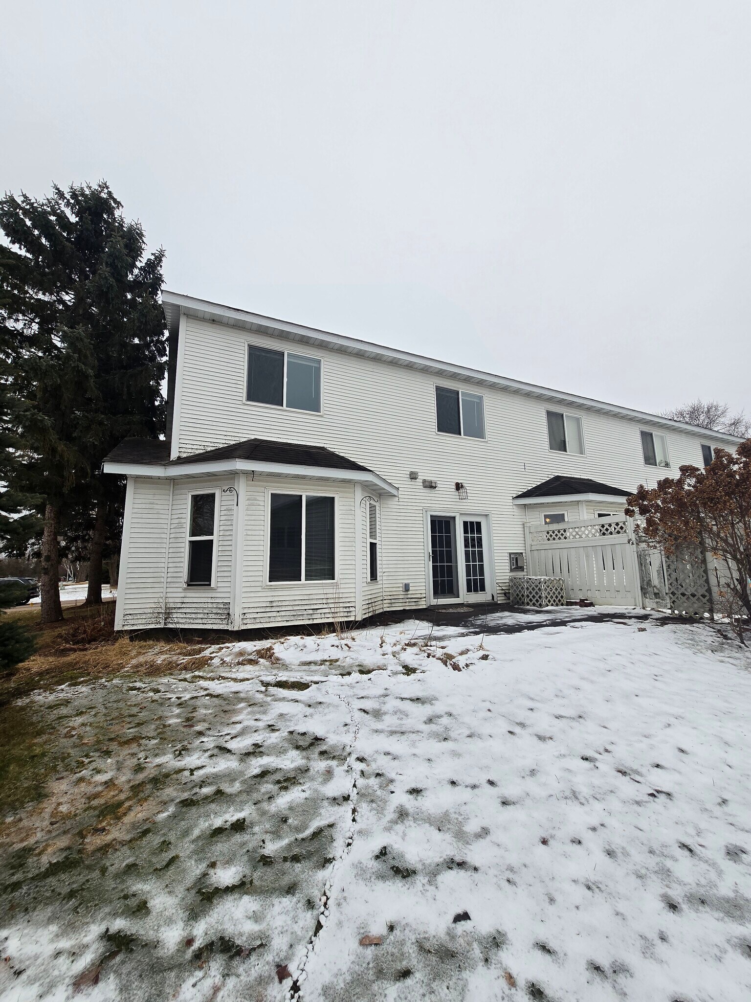 Back of unit includes a patio with a privacy fence! - 1640 Terrill St