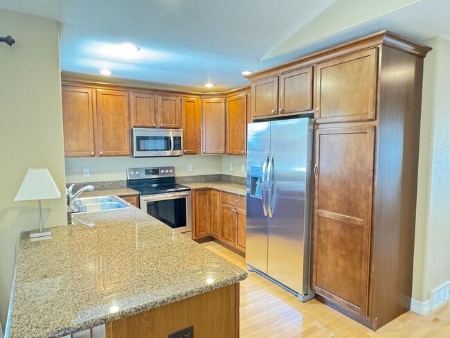 Building Photo - 4 BEDROOM, 3 BATHROOM TWINHOME WITH 2 CAR ATTACHED GARAGE IN NORTH CHEYENNE