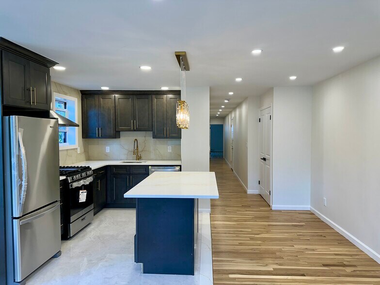 Kitchen w/ Hallway View - 6917 43rd Ave