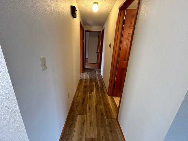 Hallway that leads to bathrooms and bedrooms - 8519 49th St W