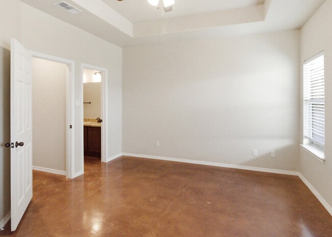 Building Photo - 3 Bedroom Duplex with Stained Concrete Floors and Greenbelt Views!