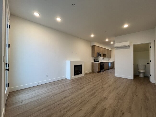 Building Photo - Modern 2-Bed, 1.5-Bath Condo with Custom Kitchen, Private Patio, and Prime Location