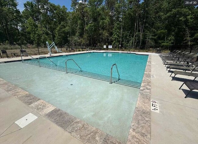 Building Photo - 1 year old 5 bedroom home w community pool!