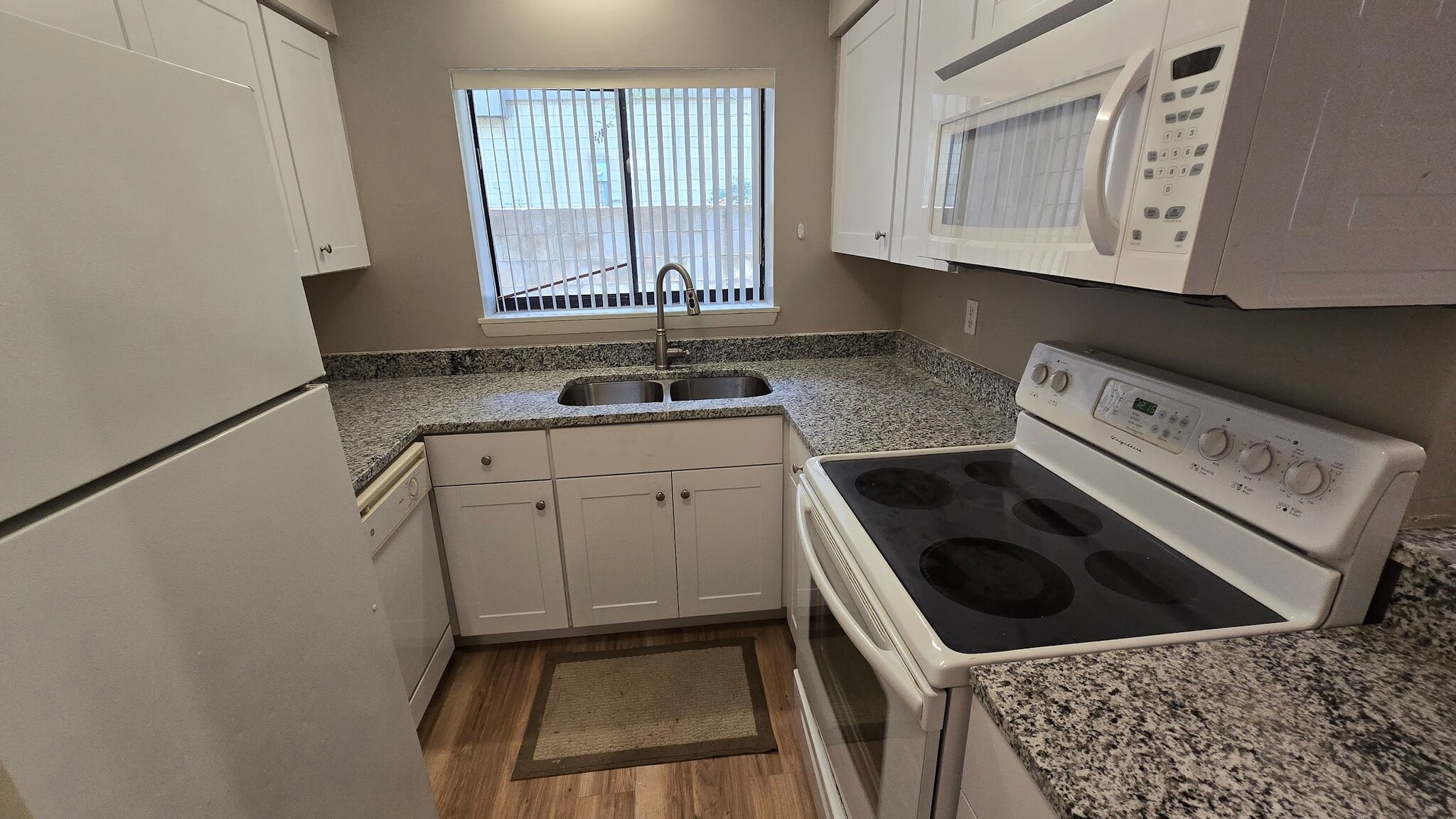 Kitchen 2 includes dishwasher, smoothtop stove and microwave. - 4226 SW 69th Ter