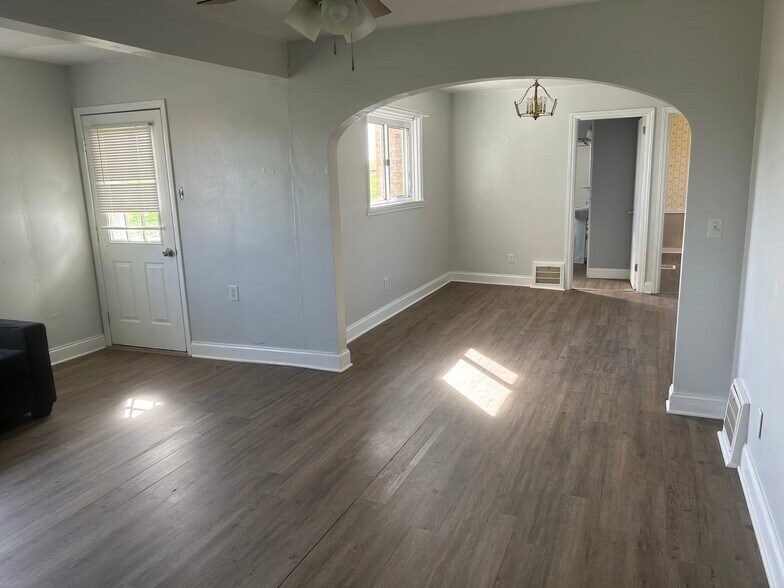 Spacious living room with back entrance to the patio. - 203 Reibold Rd