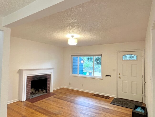 Building Photo - This beautifully updated home offers a bri...