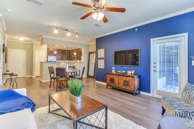 Large Living Room with open concept kitchen and ceiling fan - Aspire Mckinney Ranch