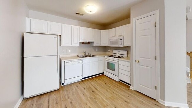 Building Photo - Townhome | Hard Surface Floors Through-Out...