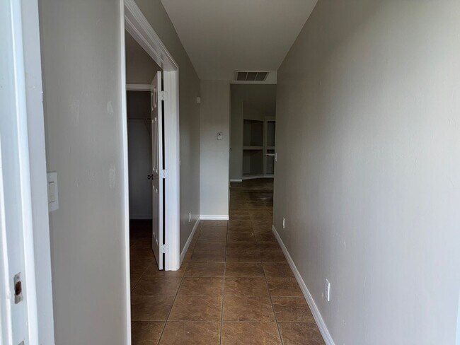 Building Photo - Experience this Cape Coral 3 bedroom 2 bath corner duplex with 1 car garage and screened in lanai.