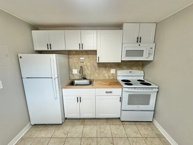 Experience the charm of this sleek and efficient kitchen setup. - Country Club