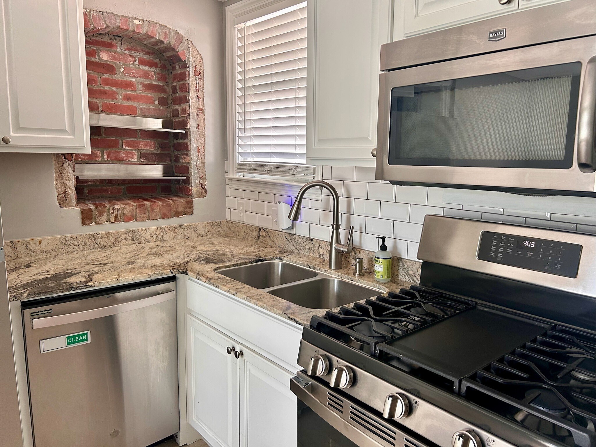So many unique details in this home, like this exposed brick alcove in kitchen - 1118 Colquitt Ave NE
