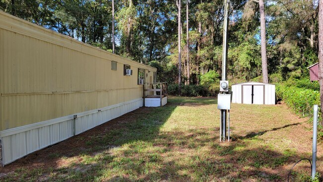 Building Photo - 2 Bed | 1 1/2 Bath | Fenced & Gated 1/4 Acre of land