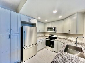 Building Photo - Newly remodeled 2B/2BA Condo w/ reserved p...